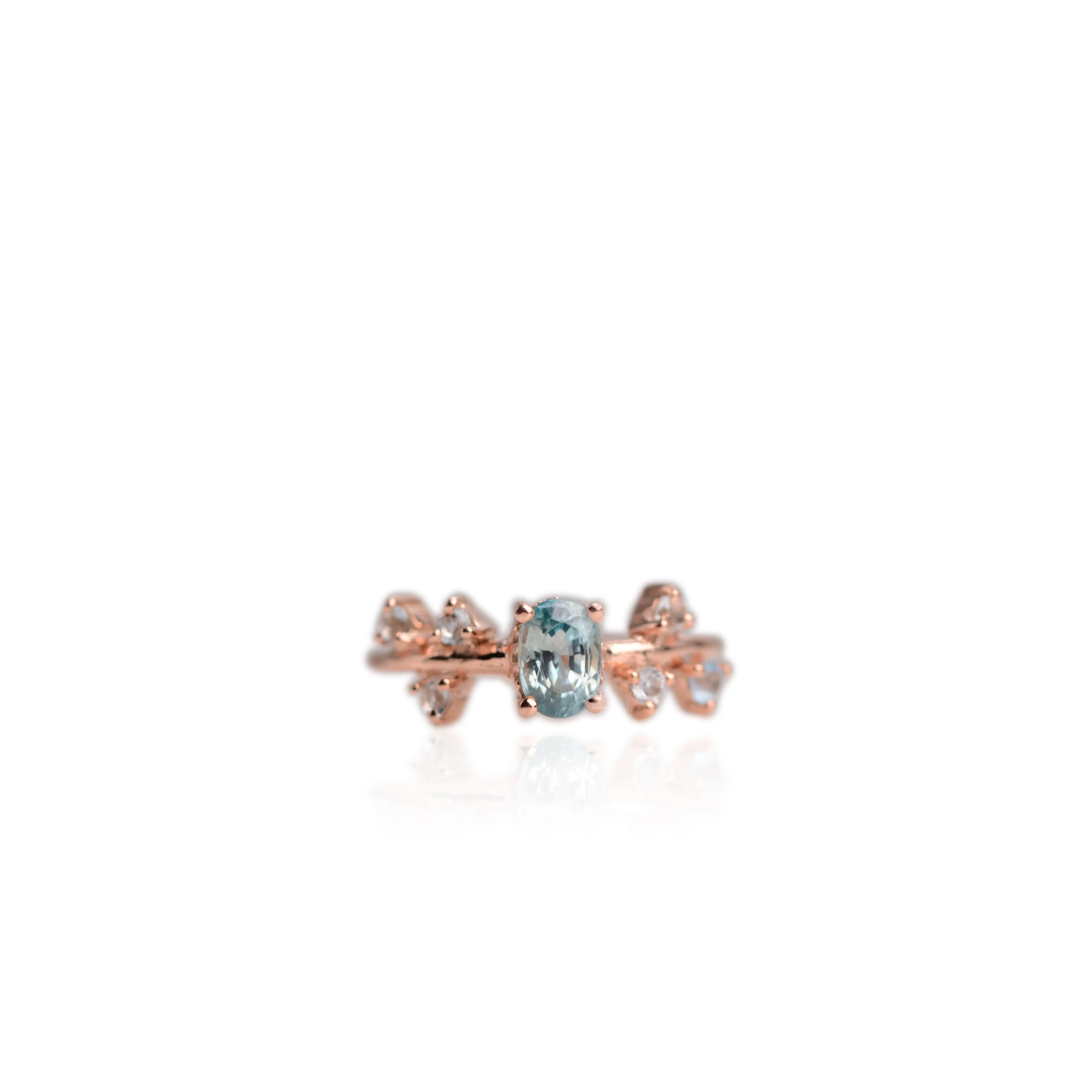 5 x 7 mm. Oval Cut Blue Cambodian Zircon with Topaz Accents Ring