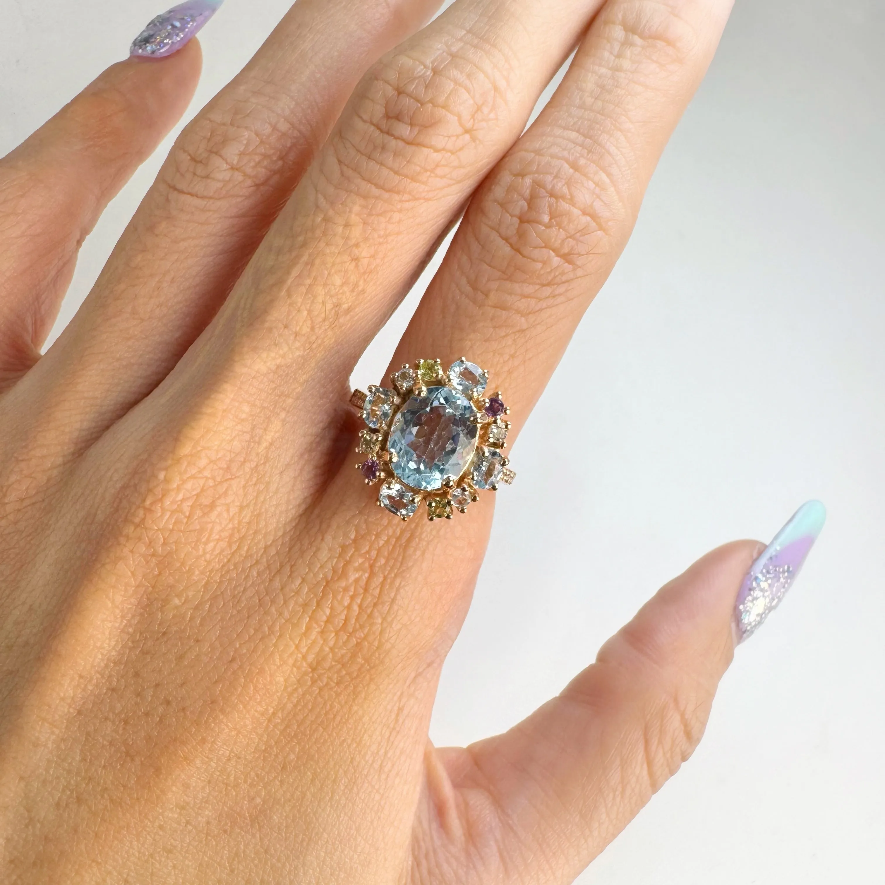 8 x 10 mm. Oval Cut Sky Blue Topaz, Amethyst, Citrine and Peridot Cluster Ring