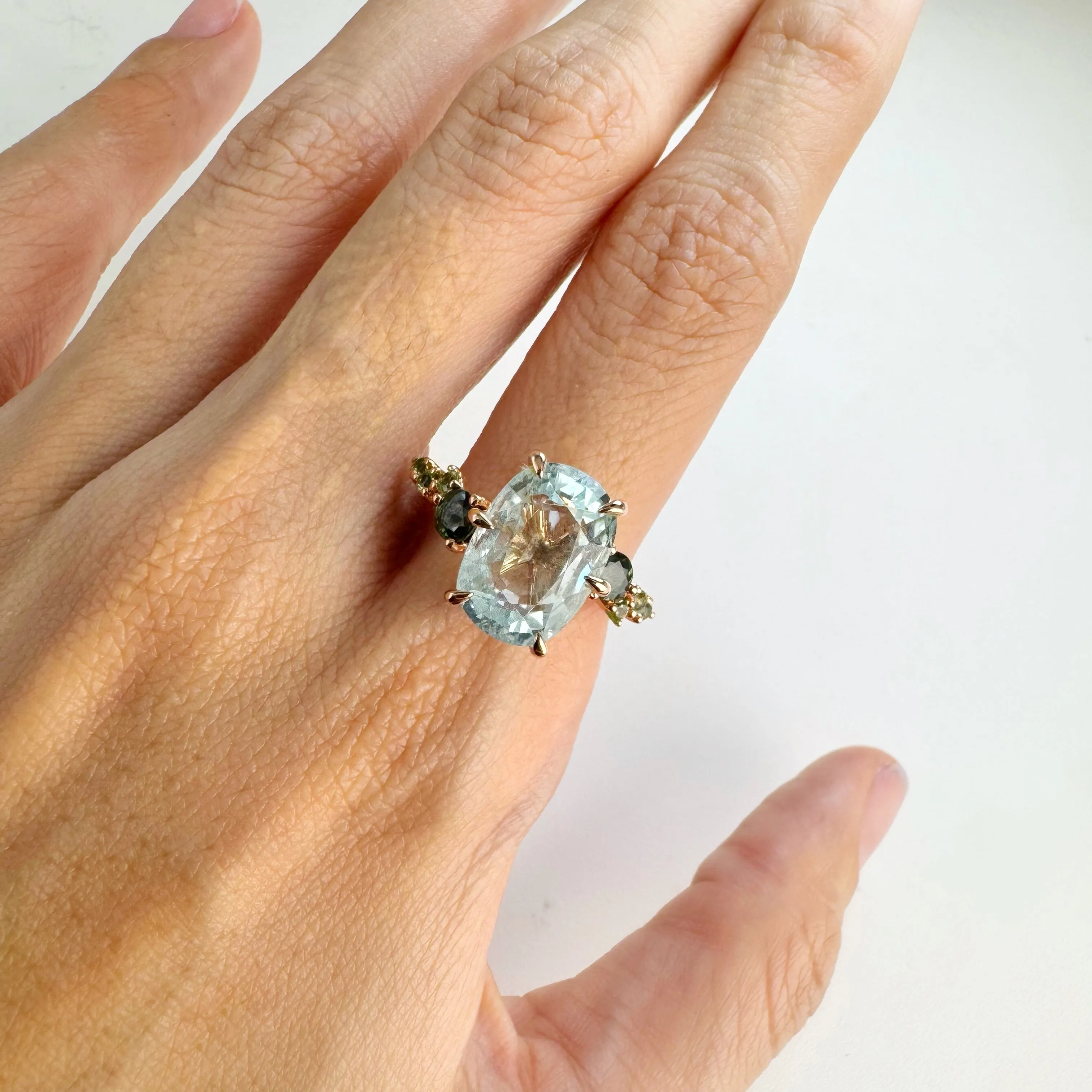 Handmade 9 x 13 mm. Oval Cut Blue Brazilian Aquamarine with Sapphire and Peridot Accents Ring