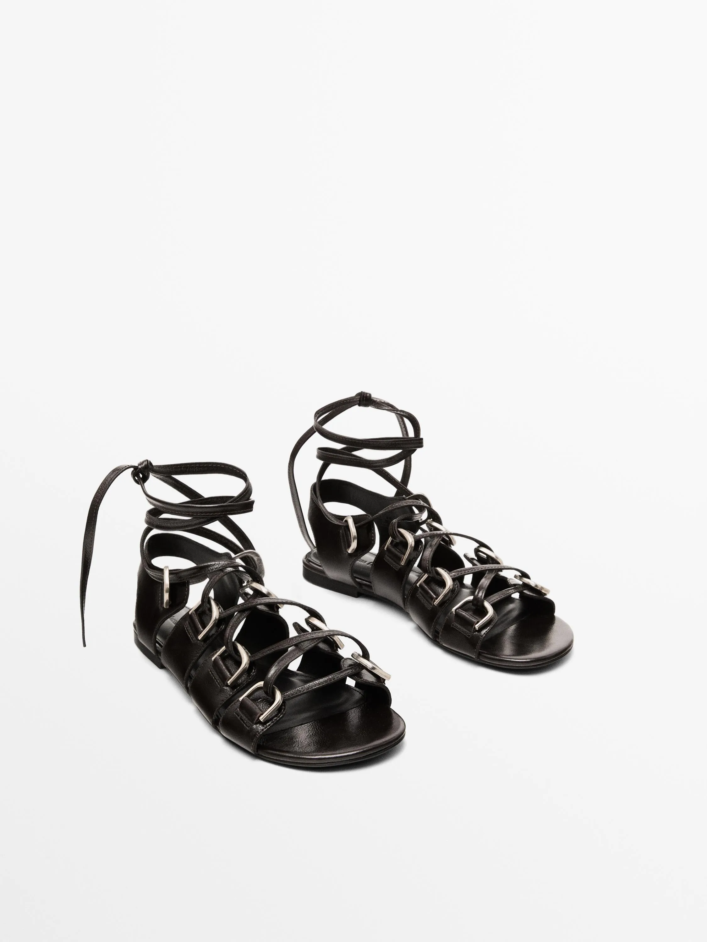 Lace-up sandals with rings