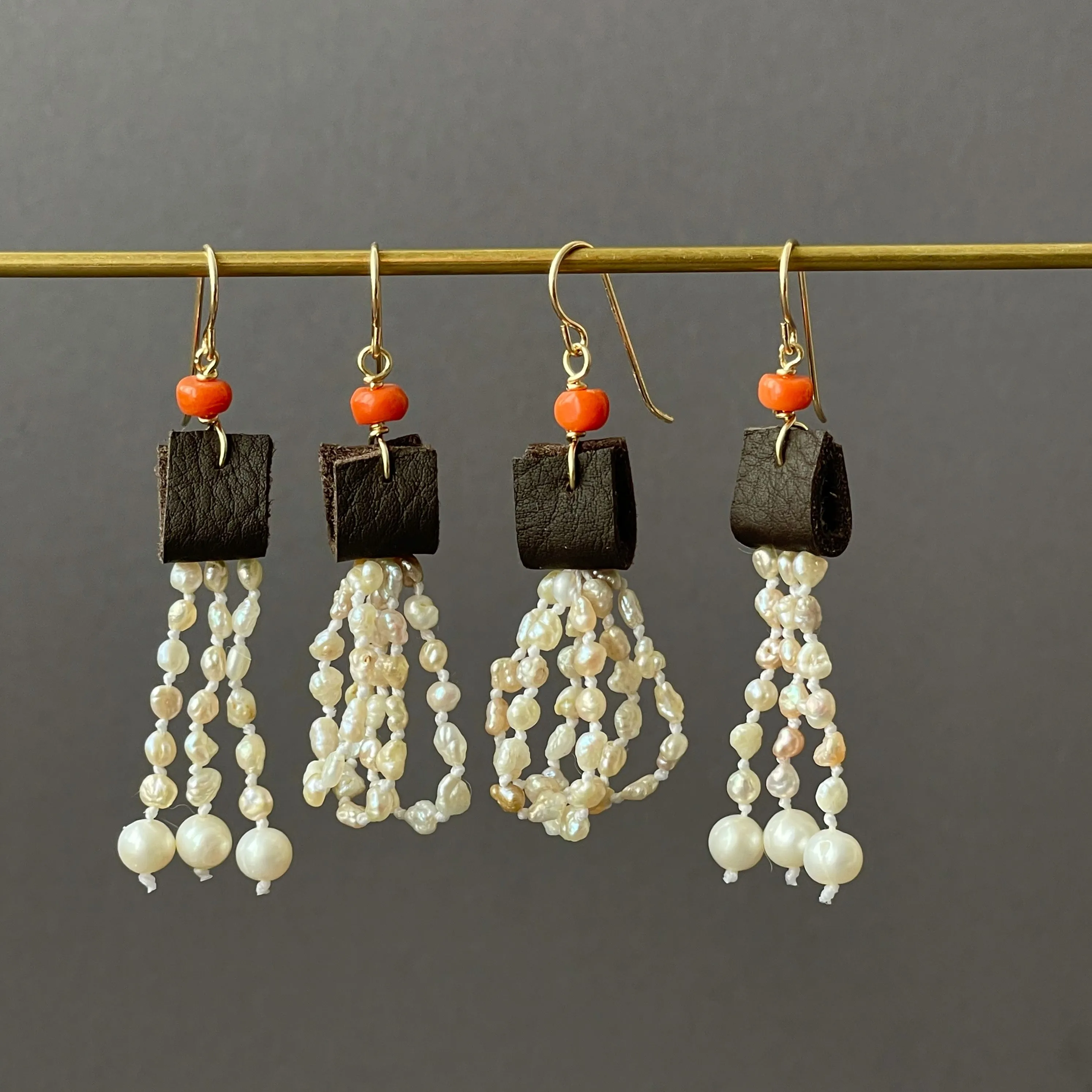 leather and coral pearl dangle earrings