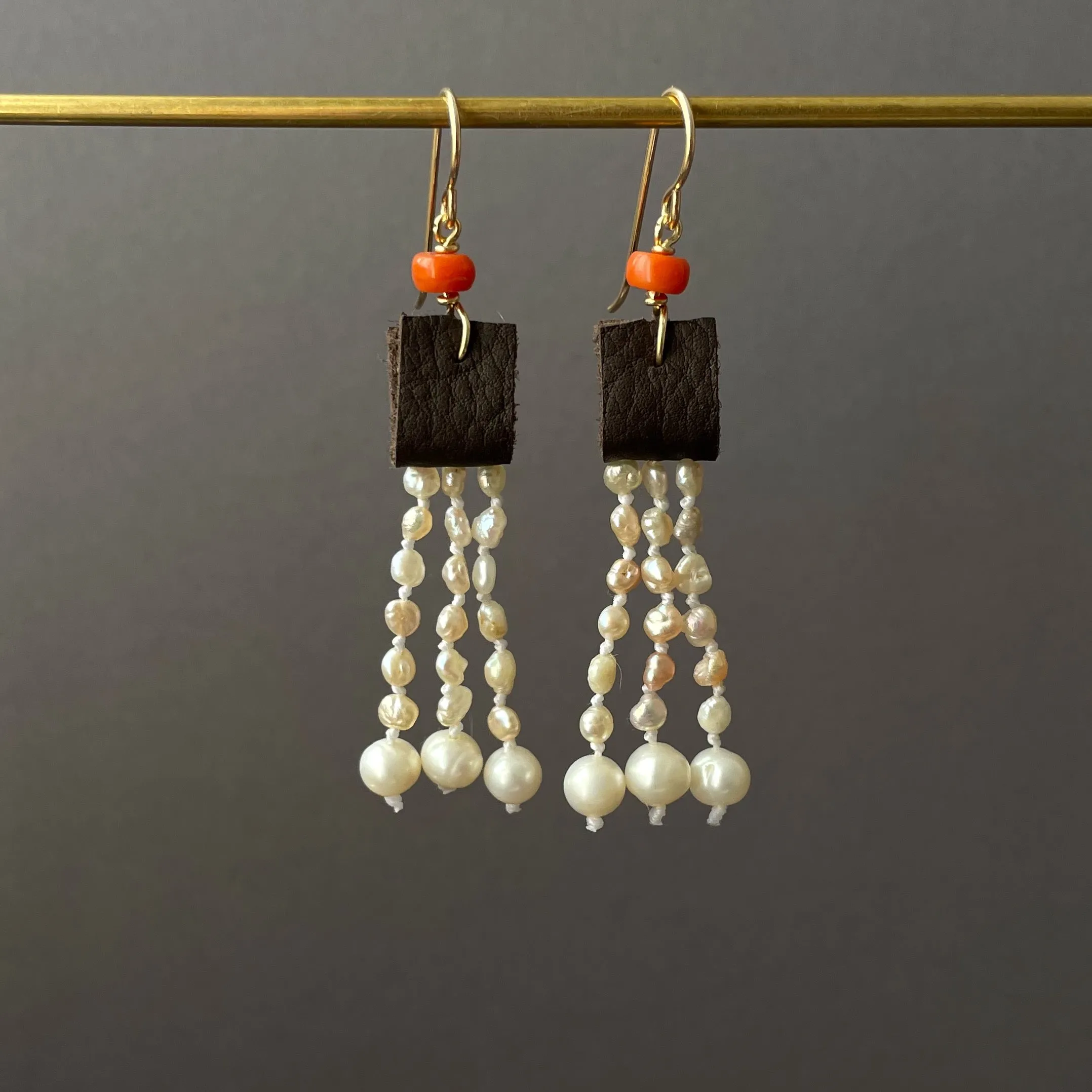 leather and coral pearl dangle earrings