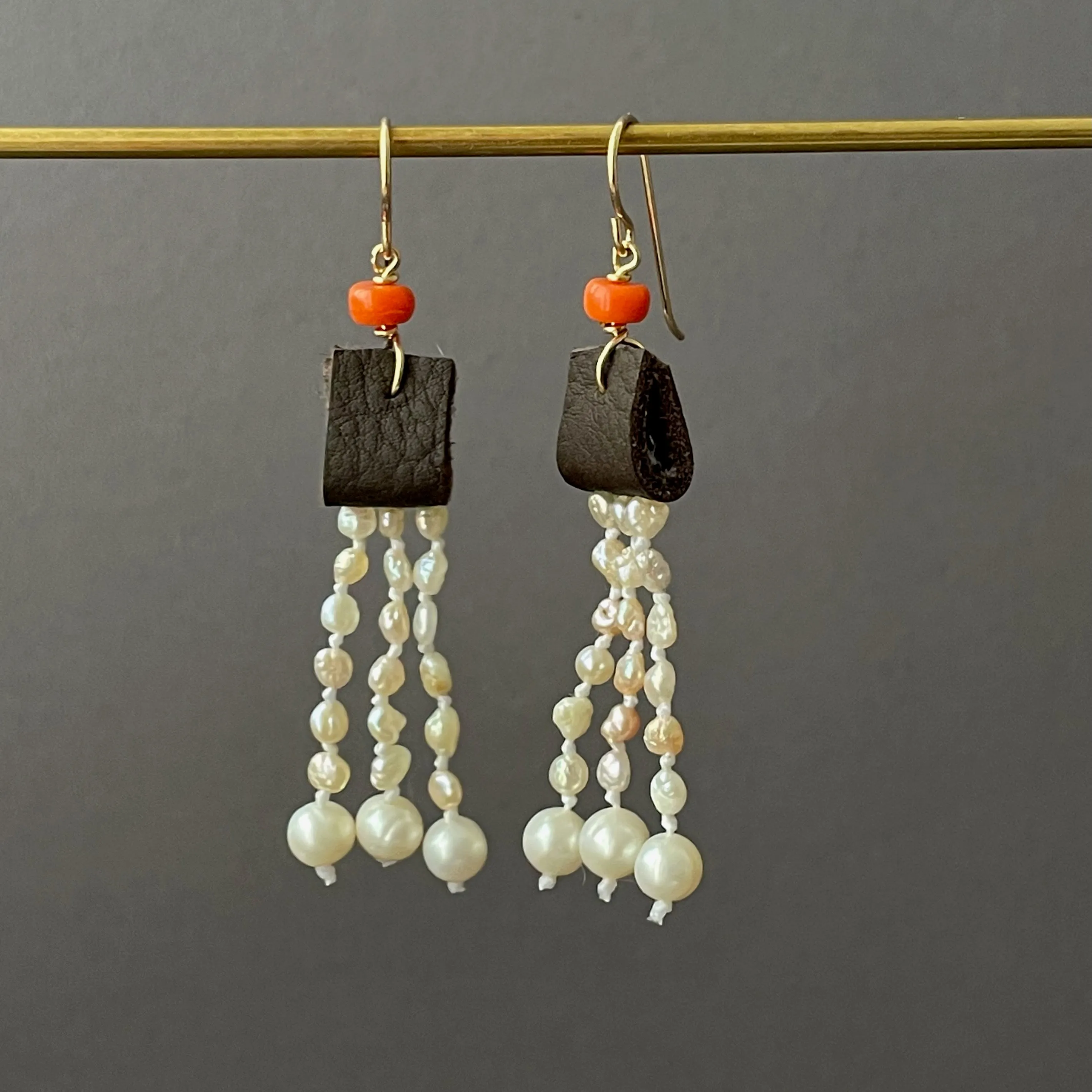 leather and coral pearl dangle earrings