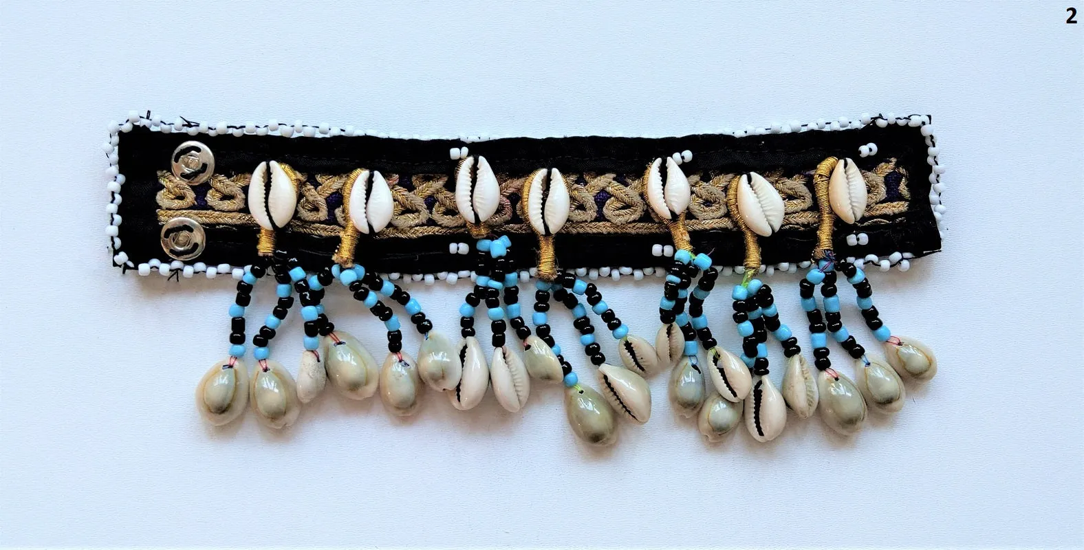 Tribal bracelet with real cowrie shell tassels